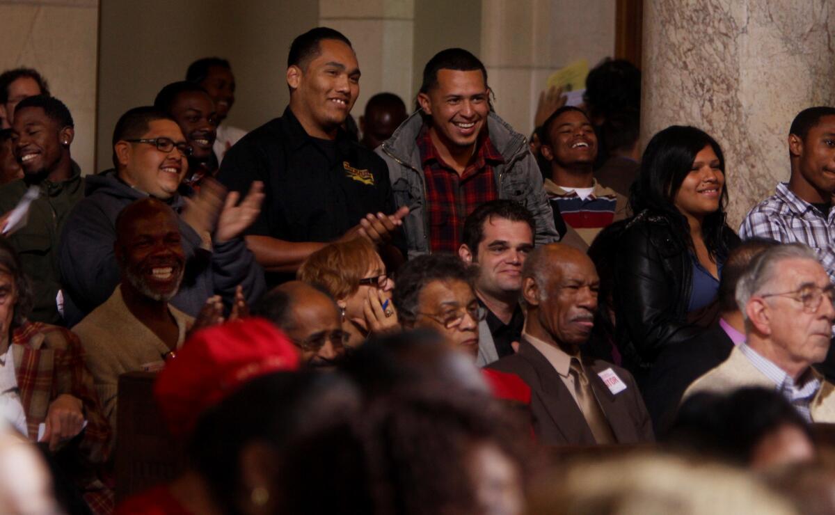 In this March 2012 photo, people listen to a Los Angeles City Council meeting. Like many government bodies across the country, the L.A. council has often wrestled with how to regulate public comments and keep meetings orderly.