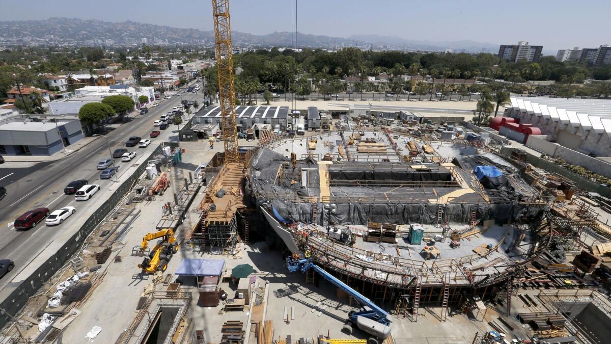 Construction is underway at the site of the future Academy Museum of Motion Pictures at the corner of Wilshire Blvd. and Fairfax Ave.