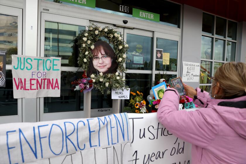 NORTH HOLLYWOOD, CA - DECEMBER 28: A memorial for Valentina Orellana Peralta at the door of the Burlington Coat Factory. The League of United Latin American Citizens seeks answers in the killing of 14-year-old Valentina Orellana Peralta, requesting a full investigation and meeting with Los Angeles Police Chief Michel Moore and Mayor Eric Garcetti, in a press conference at the Burlington Coat Factory on Tuesday, Dec. 28, 2021 in North Hollywood, CA. The site where a 14-year-old girl was shot and killed when LAPD was trying to apprehend an individual inside the store. The suspect Daniel Elena-Lopez was killed, as was Valentina Orellana-Peralta, a 14-year-old trying on clothes in a dressing room nearby. (Gary Coronado / Los Angeles Times)