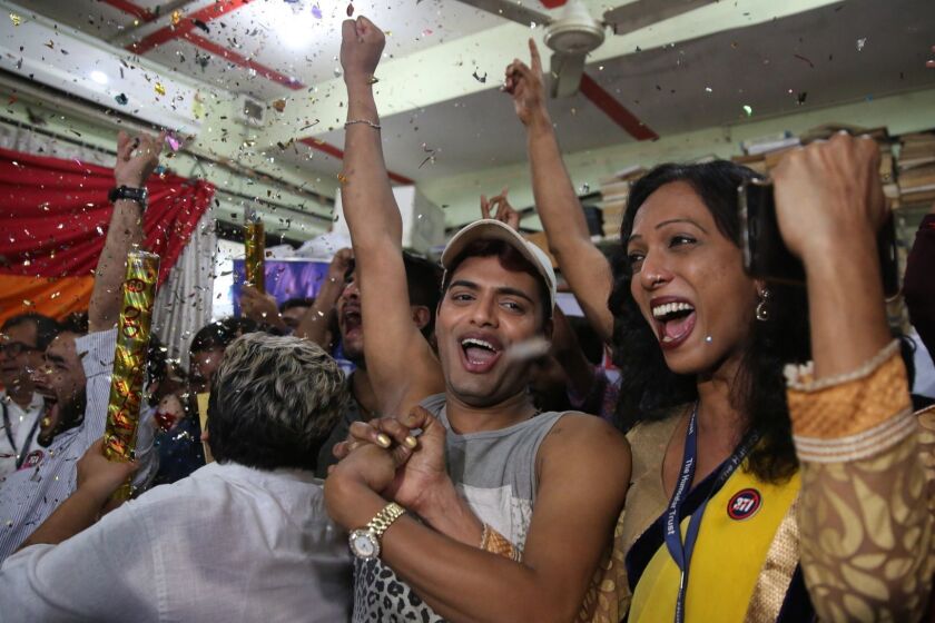 Supporters and members of the LGBT community celebrate after the country's top court struck down a colonial-era law that makes homosexual acts punishable by up to 10 years in prison, in Mumbai, India, Thursday, Sept. 6, 2018. The court gave its ruling Thursday on a petition filed by five people who challenged the law, saying they are living in fear of being harassed and prosecuted by police. (AP Photo/Rafiq Maqbool)