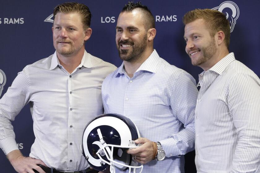 THOUSAND OAKS, CA -- MARCH 12, 2018: Los Angeles Rams general manager Les Snead, left, with new safety Eric Weddle and coach Sean McVay during the team's announcement. (Myung J. Chun / Los Angeles Times)