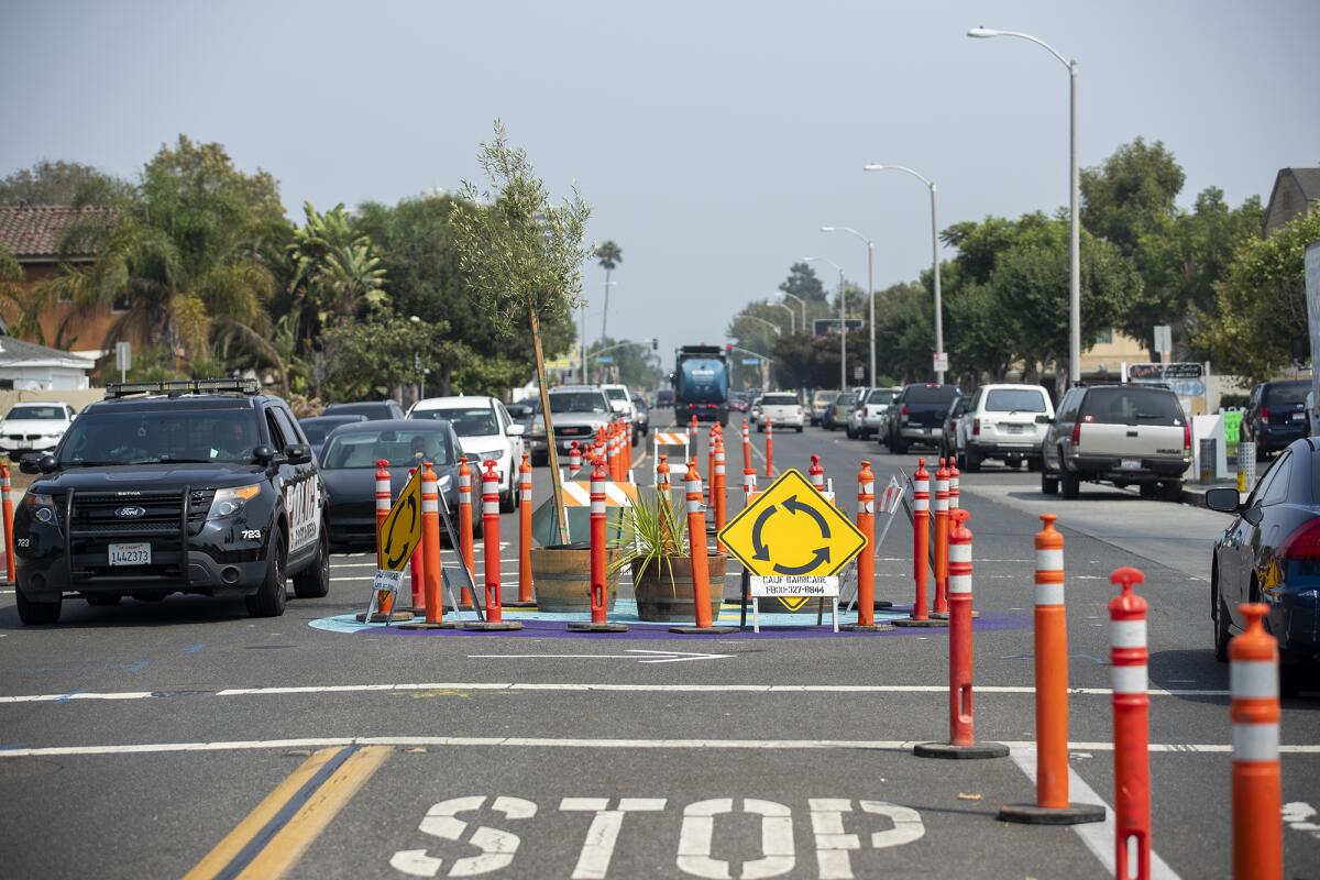 Cars line up at the intersection at 19th St. and Monrovia Ave. in Costa Mesa.