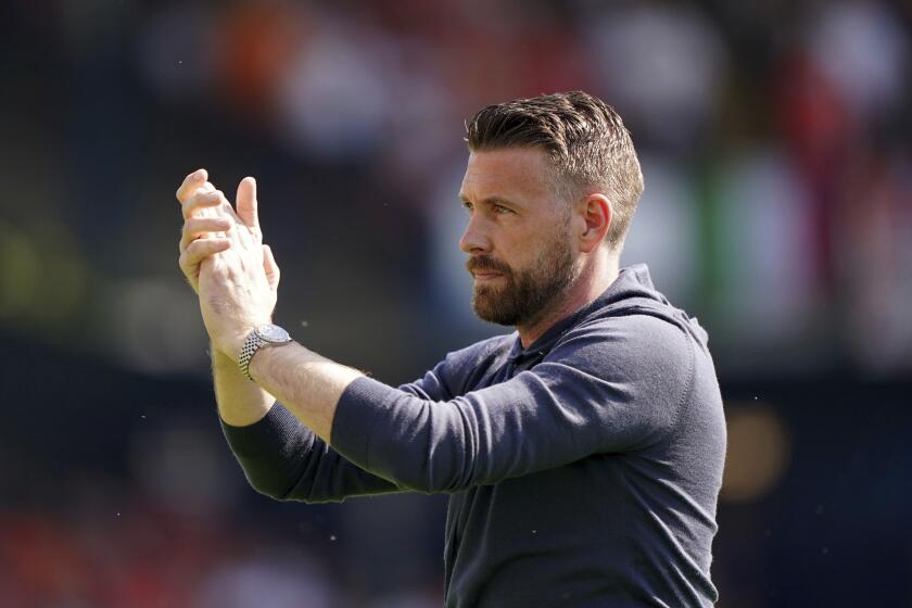 Luton Town manager Rob Edwards applauds the fans ahead of the Premier League match at Kenilworth Road, Luton, Sunday May 19, 2024. (Joe Giddens/PA via AP)