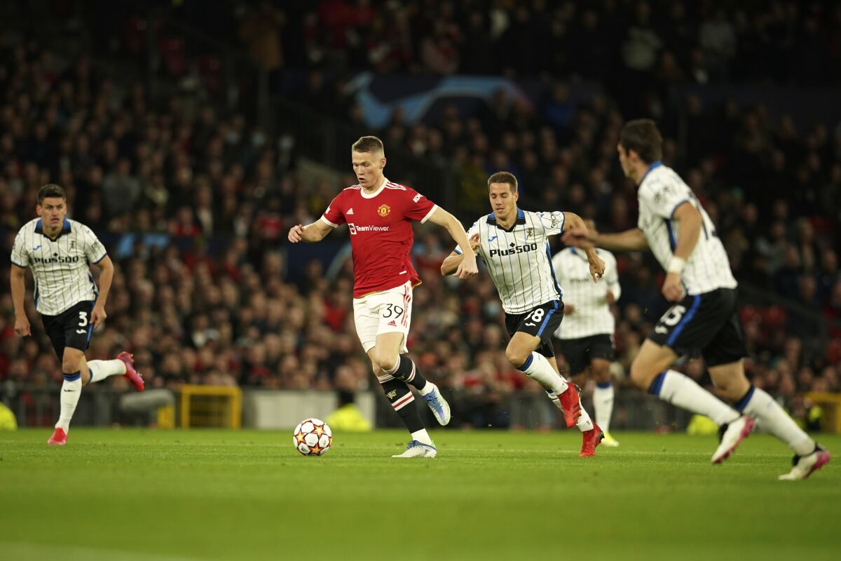 Manchester United's Scott McTominay controls the ball during the Champions League Group F soccer match between Manchester United and Atalanta at Old Trafford, Manchester, England, Wednesday, Oct. 20, 2021. (AP Photo/Dave Thompson)