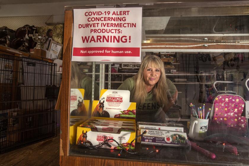 ROLLING HILLS, CA - SEPTEMBER 13, 2021: Tracey Savich, owner of Rolling Hills General Store, is photographed inside her store. Inside display case is ivermectin, an anti-parasitic drug, commonly used to deworm horses, cows and other livestock that has been controversially touted as a preventative and treatment for COVID-19, particularly among those who remain skeptical about the vaccine. While its efficacy against COVID-19 has been debunked, some Californians have managed to acquire prescriptions from their healthcare providers. (Mel Melcon / Los Angeles Times)