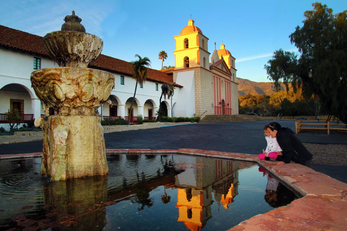A parent and child visit Santa Barbara Mission