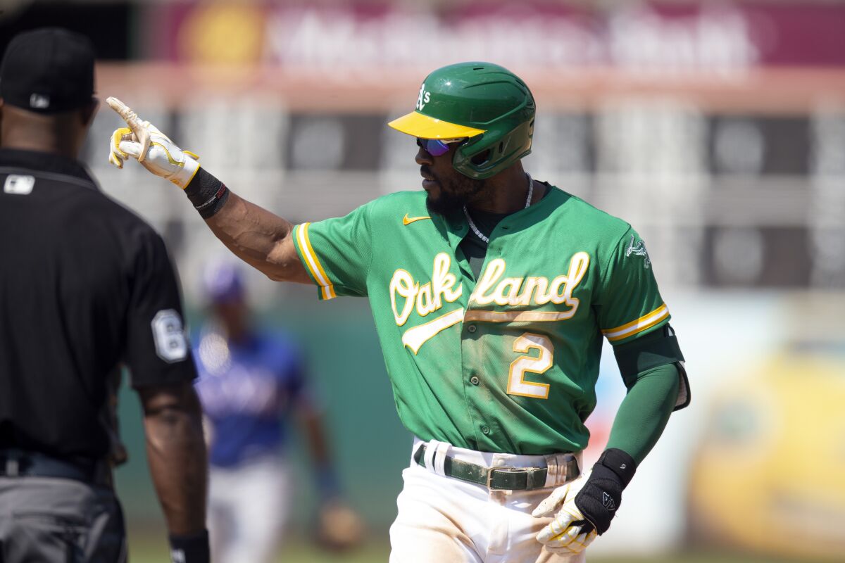 Oakland Athletics center fielder Starling Marte (2) gestures to his dugout after hitting safely for the fourth time in a baseball game during the sixth inning against the Texas Rangers, Sunday, Aug. 8, 2021, in Oakland, Calif. (AP Photo/D. Ross Cameron)