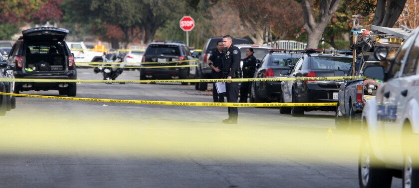 Burbank police investigate a large area where two people were shot on the 1700 block of Catalina St. in Burbank on Wednesday, Dec. 9, 2015.