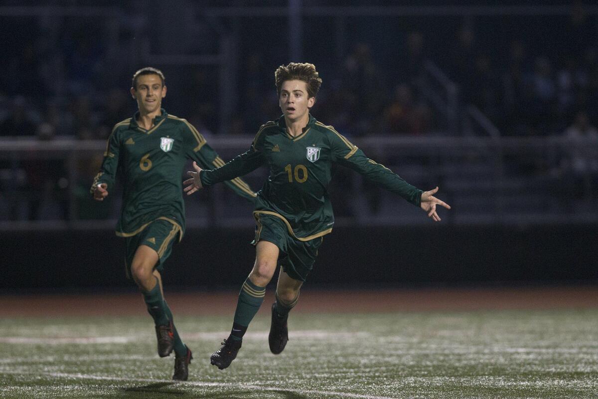 Edison High’s Sam Kemper (10) reacts after giving the Chargers a 1-0 lead during the first half against Los Alamitos in a game on Wednesday.