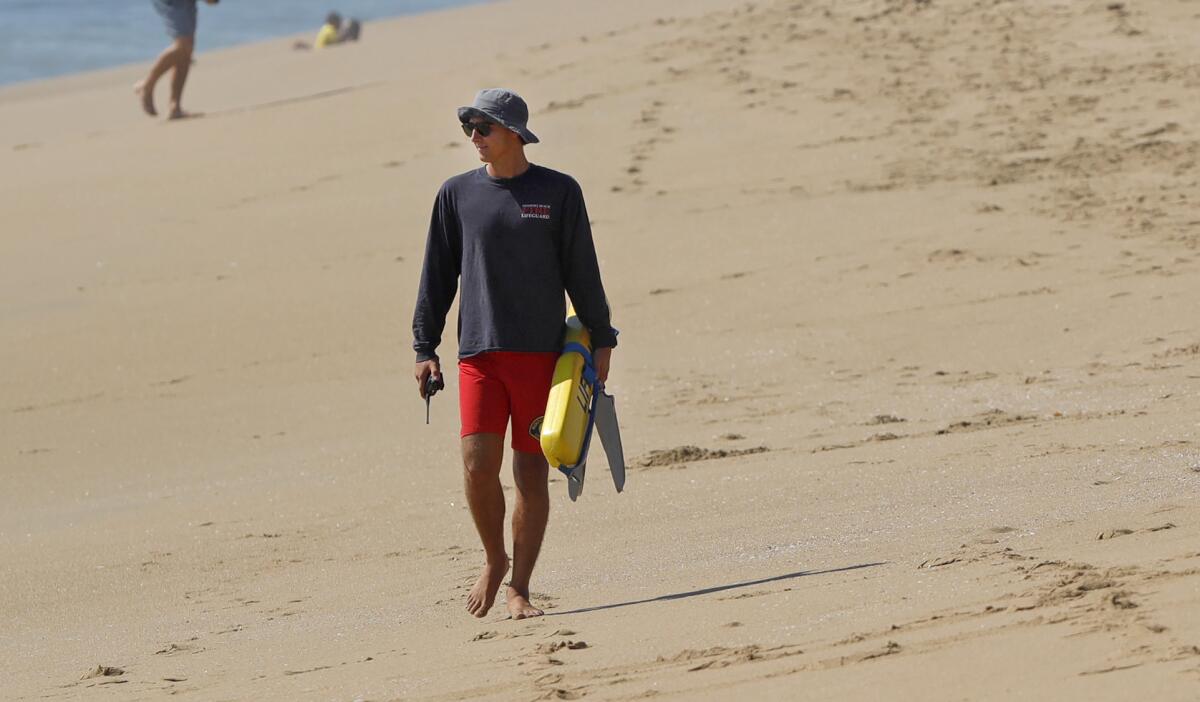A Newport Beach lifeguard watches everyone.