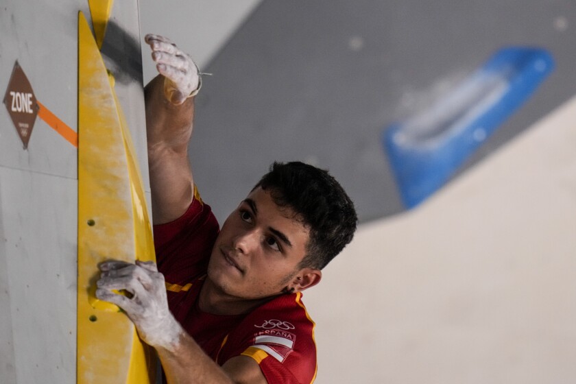 Spain's Alberto Gines Lopez competes during the bouldering portion of the men's sport climbing final.