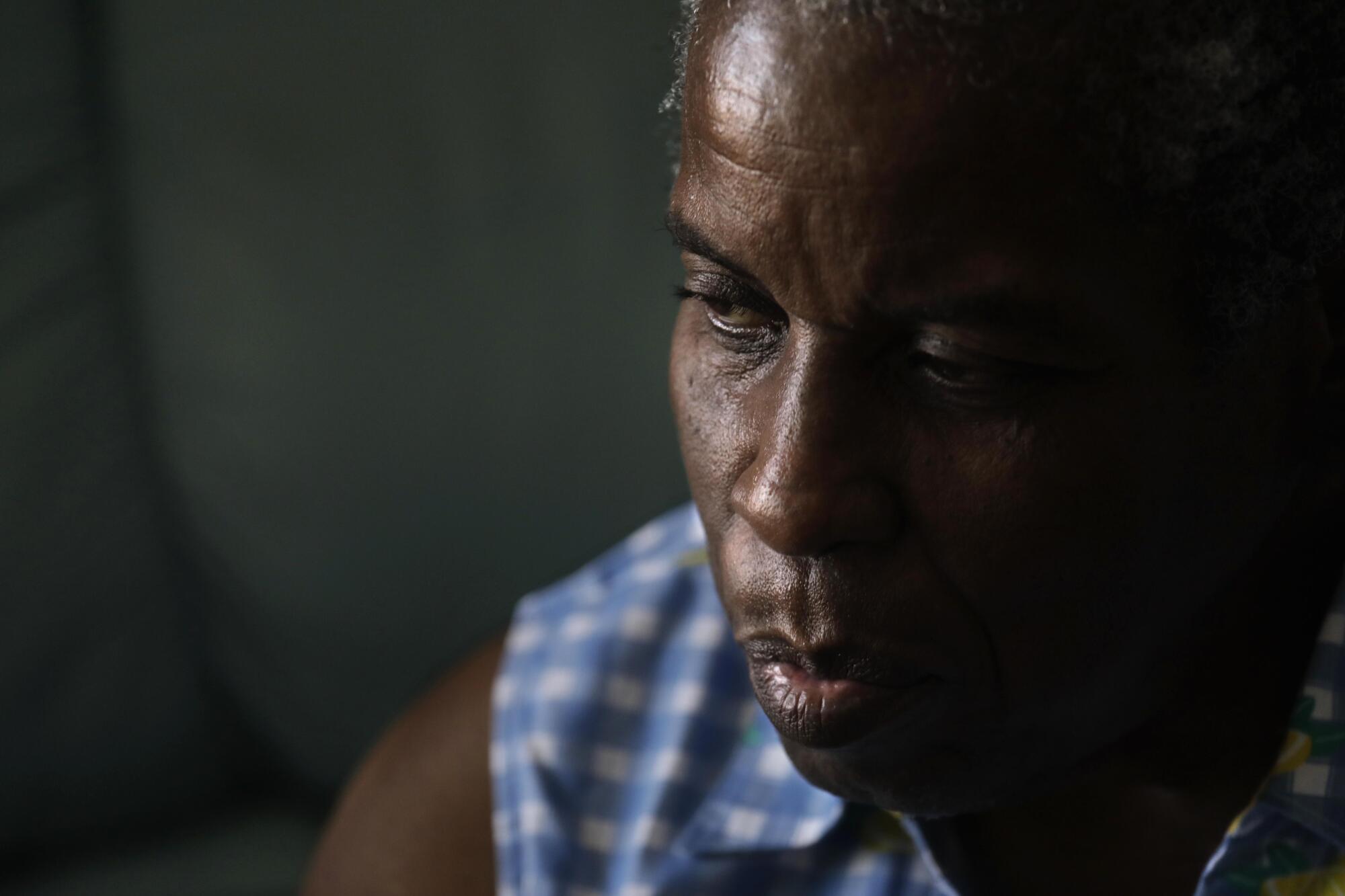 Frances Mae Jones, in her room at the Beverly Hills Senior Care facility, listens to Dr. Shayan Rab