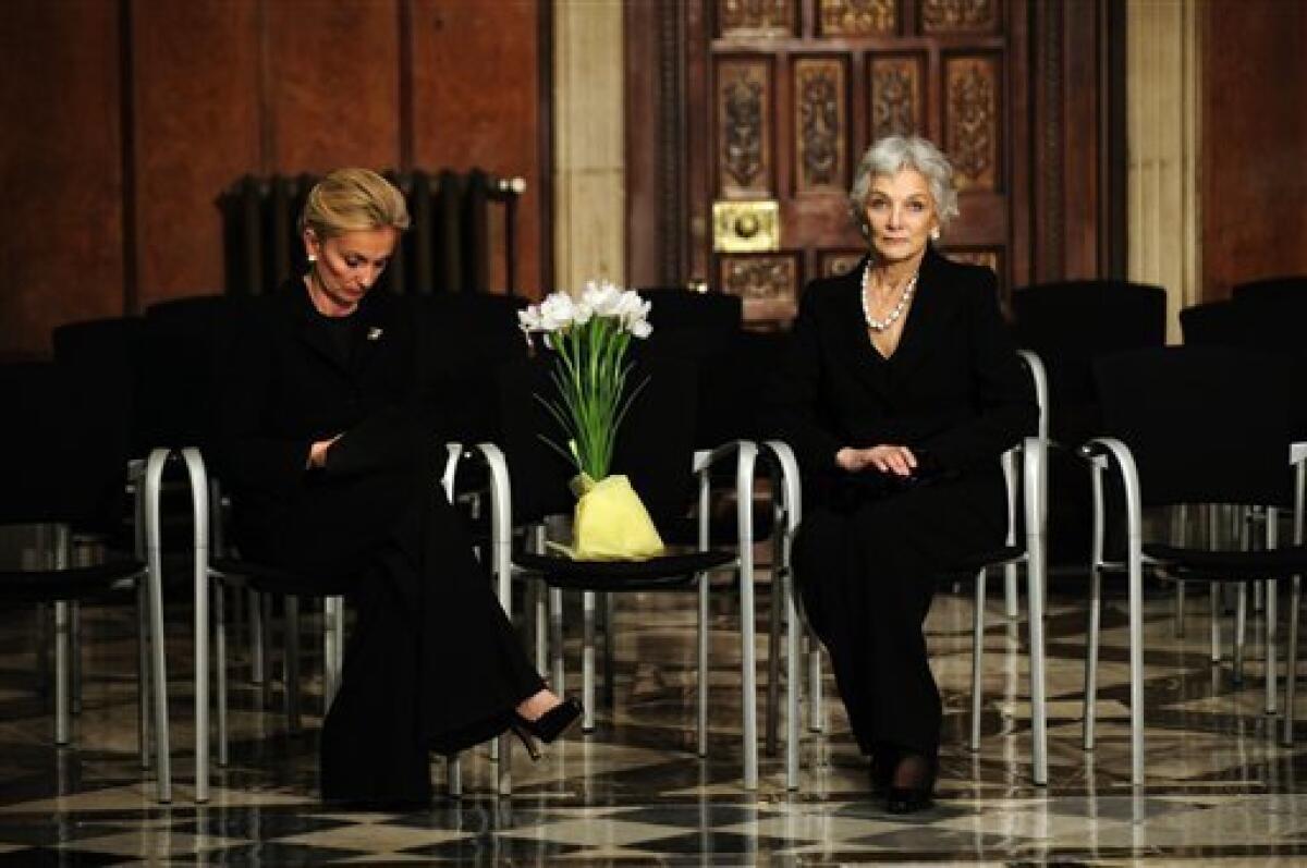 Lluisa Sellent, right, widow of former International Olympic Committee president Juan Antonio Samaranch and his daughter Maria Teresa Samaranch sit after the farewell ceremony at the Palau of Generalitat in Barcelona, Spain, on Thursday, April 22, 2010. Former International Olympic Committee president Juan Antonio Samaranch died Wednesday at age 89 in the Quiron Hospital in his home city of Barcelona of cardio-respiratory failure three days after being admitted with heart problems. (AP Photo/David Ramos)