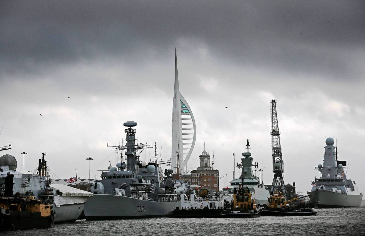 Ships are docked at a naval base in Portsmouth, England, which learned recently that it would no longer be building Britain's naval fleet. It will continue to service vessels, however.
