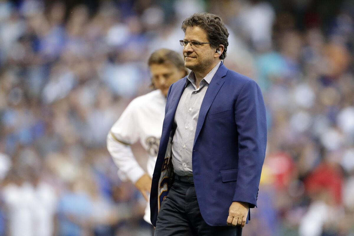 Milwaukee Brewers owner Mark Attanasio walks off the field.