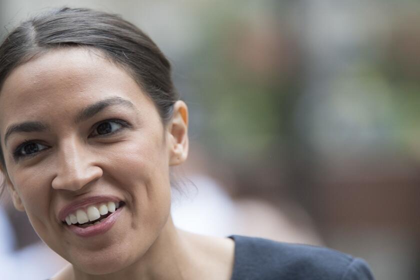 In this June 27, 2018 photo, Alexandria Ocasio-Cortez, is photographed while being interviewed in Rockefeller Center in New York. Ready or not, change is coming to the House Democrats. Across the country, a new generation of Democrats is making its way to Washington. (AP Photo/Mary Altaffer)