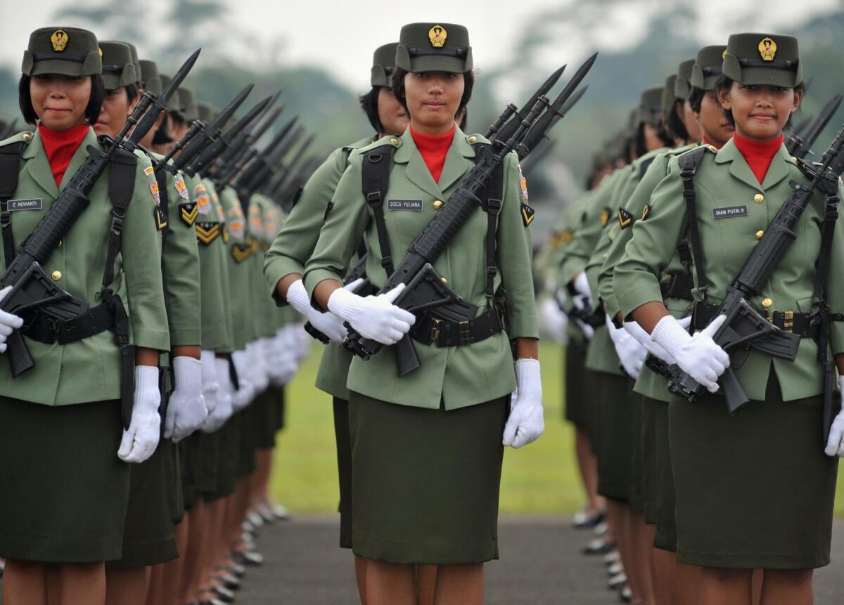(FILES) In this file photo taken on October 3, 2010, female Indonesian soldiers stand in formation during a rehearsal for the 65th anniversary ceremony of the Indonesian armed forces in Jakarta. Indonesia faced calls on May 14, 2015 to stop virginity tests for women seeking to join the military, with a leading rights group calling the practice "cruel, inhuman and degrading". AFP PHOTO / FILES / BAY ISMOYOBAY ISMOYO/AFP/Getty Images ** OUTS - ELSENT, FPG - OUTS * NM, PH, VA if sourced by CT, LA or MoD **