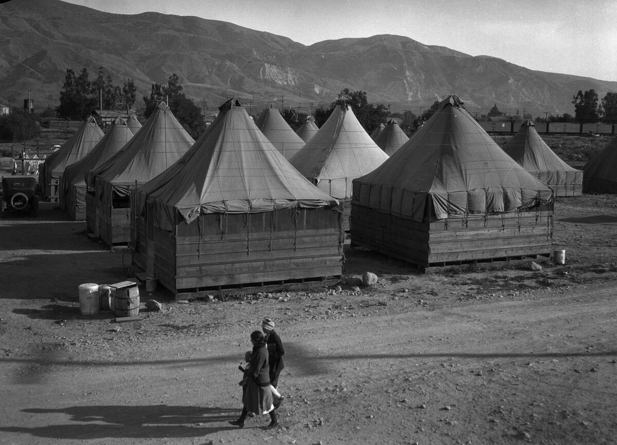 March 1928: Two women and a child in a relief camp for flood victims following the failure of the St. Francis Dam.