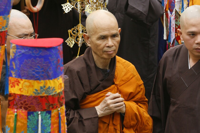 FILE - Vietnamese Zen master Thich Nhat Hanh, center, arrives for a great chanting ceremony at Vinh Nghiem Pagoda in Ho Chi Minh City, Vietnam on March 16, 2007. Zen Buddhist monk Thich Nhat Hanh, who helped pioneer the concept of mindfulness in the West and socially engaged Buddhism in the East, has died at age 95 on Saturday, Jan. 22, 2022, according to an announcement on his verified Twitter page. (AP Photo, File)