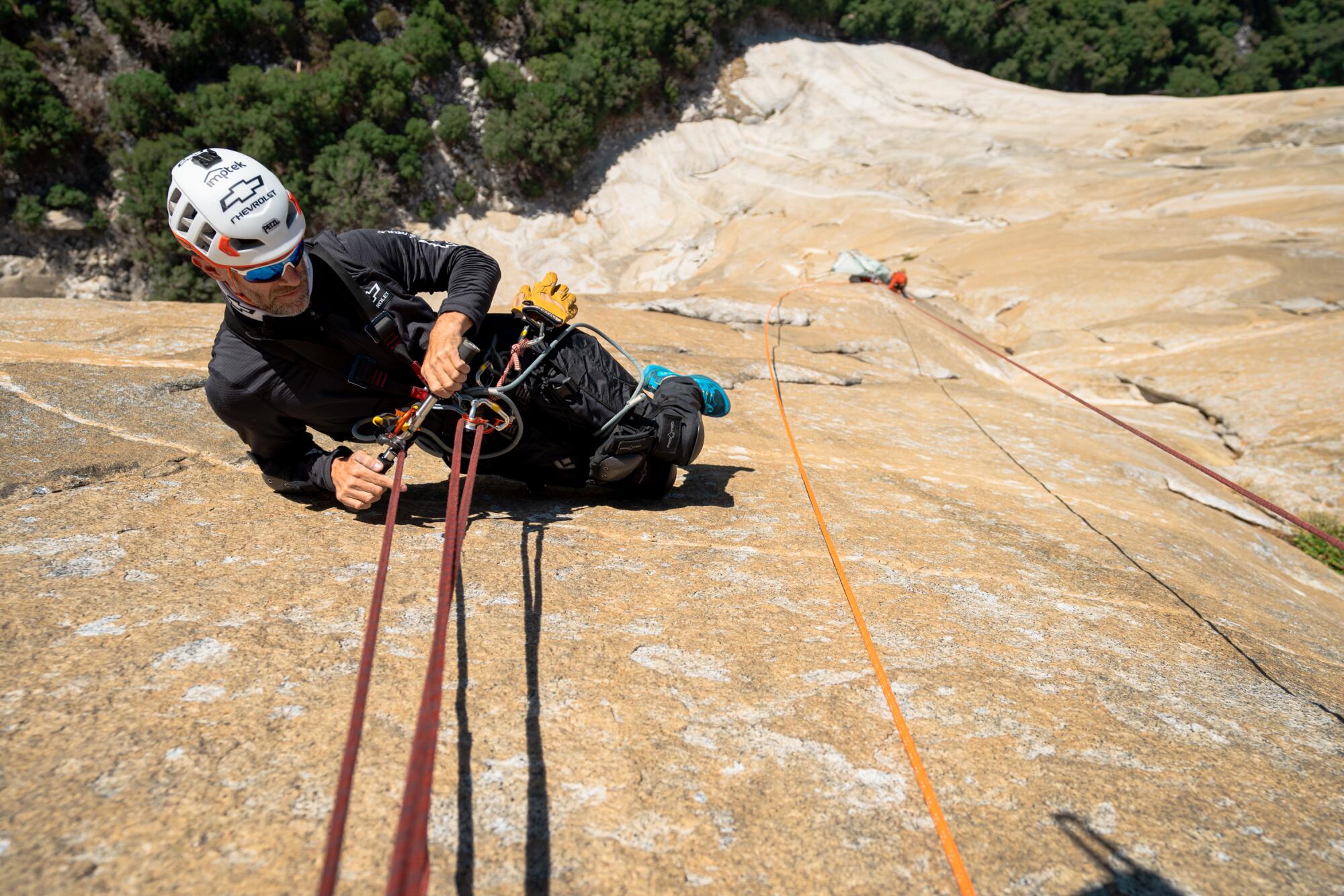 Zuko Carrasco uses a rope to ascend El Capitan. 