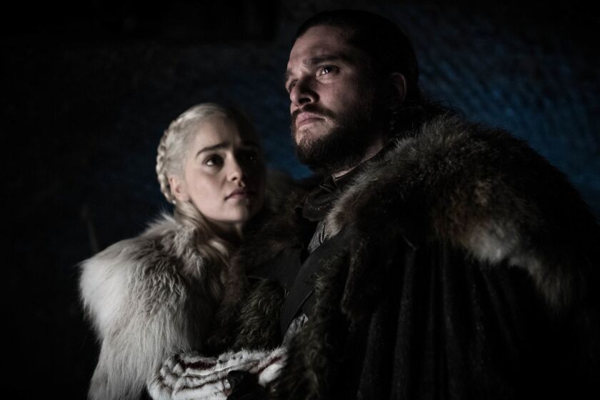 This image released by HBO shows Emilia Clarke and Kit Harington in a scene from "Game of Thrones," that aired Sunday, April 21, 2019. With the Game of Thrones' Jon Snow revealing his royal lineage to his potential rival Daenerys Targaryen, the beleaguered army at Winterfell is about to find out if two chief executives better than one. (Helen Sloan/HBO via AP)