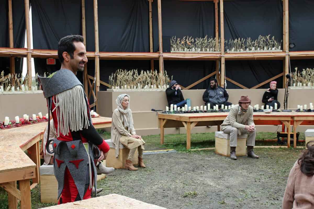 Fahad Siadat, left, in costume as Brother, waits for videotaping to begin.