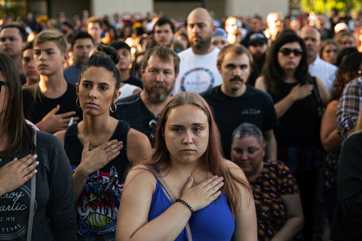 Residents attend a vigil for three people who were killed in a shooting at the Gilroy Garlic Festival in Northern California in July.