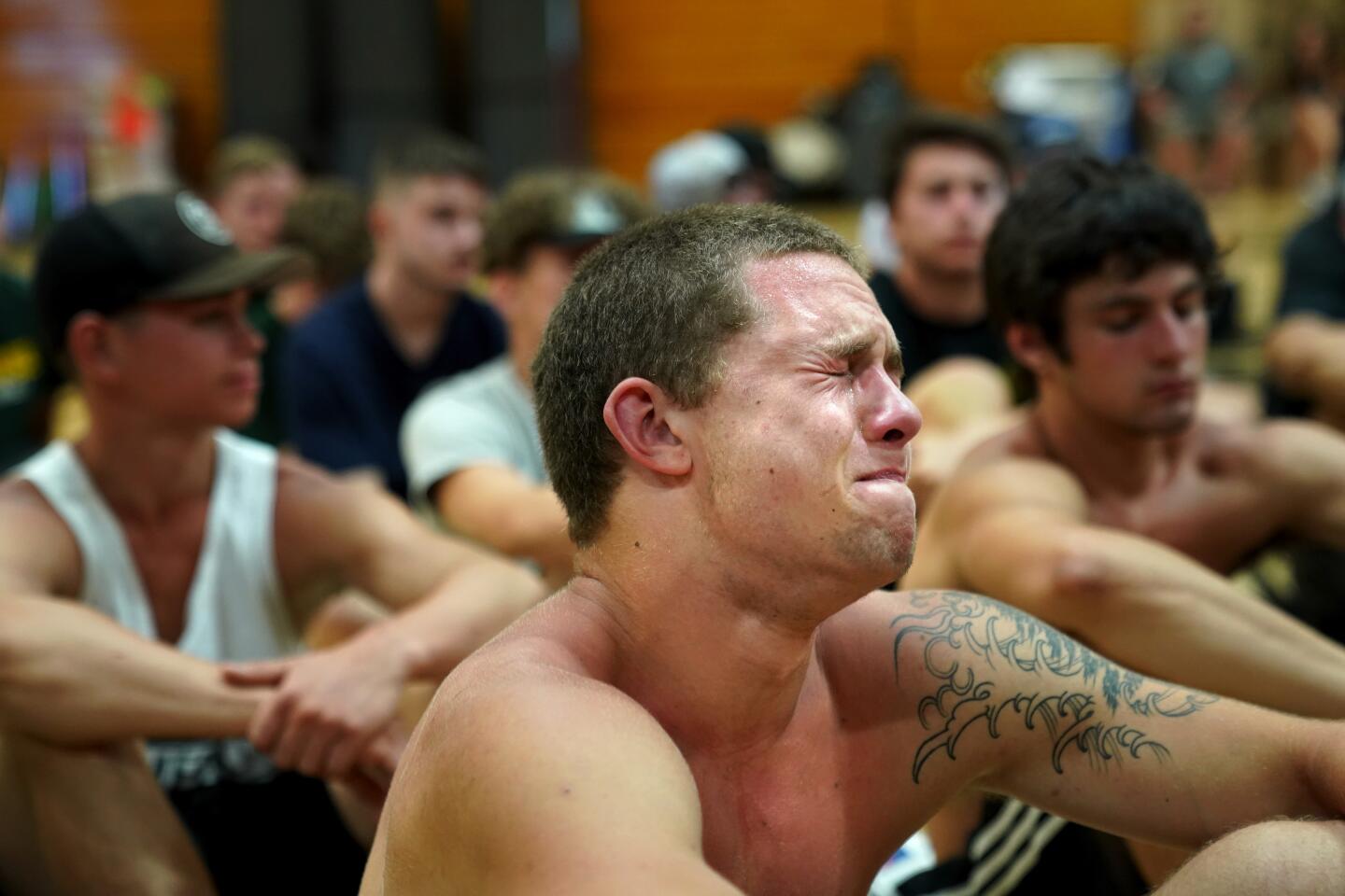 Wally Skalij THE CAMP FIRE devastated their town last November, but the Paradise Bobcats have been back practicing, top and middle. Lukas Hartley is moved by a coach’s speech. The team’s first game is Friday.