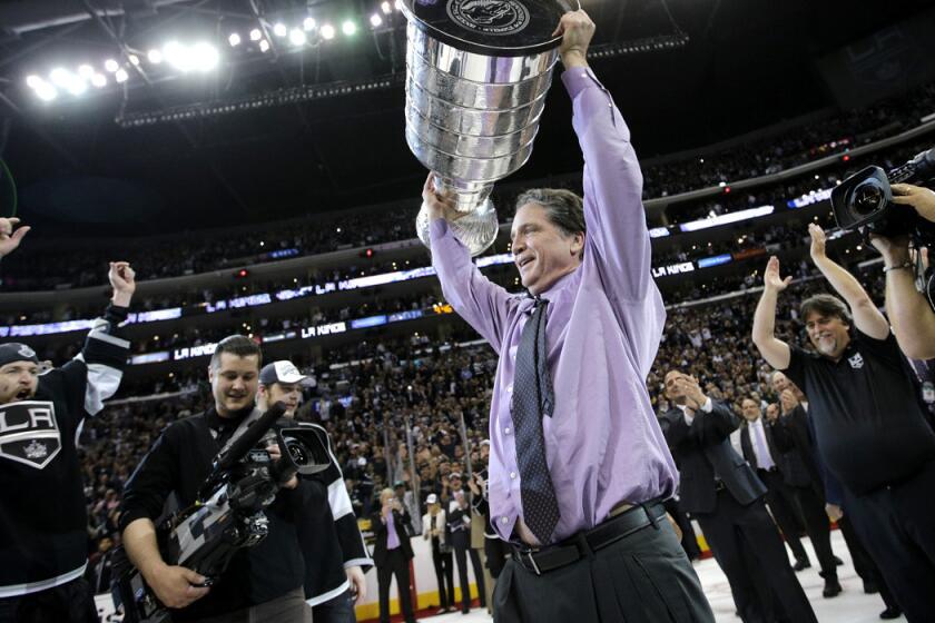 Kings General Manager Dean Lombardi raises the Stanley Cup after the team beat the New York Rangers in Game 5 of the Final last week.