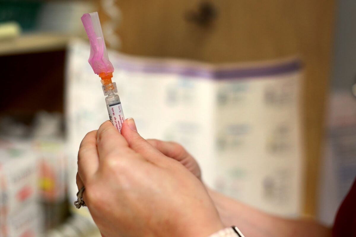 a vaccine syringe. 