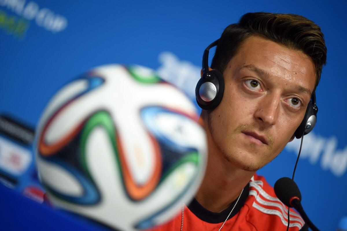 Germany's midfielder Mesut Ozil addresses a press conference in the Pernambuco Arena in Recife.
