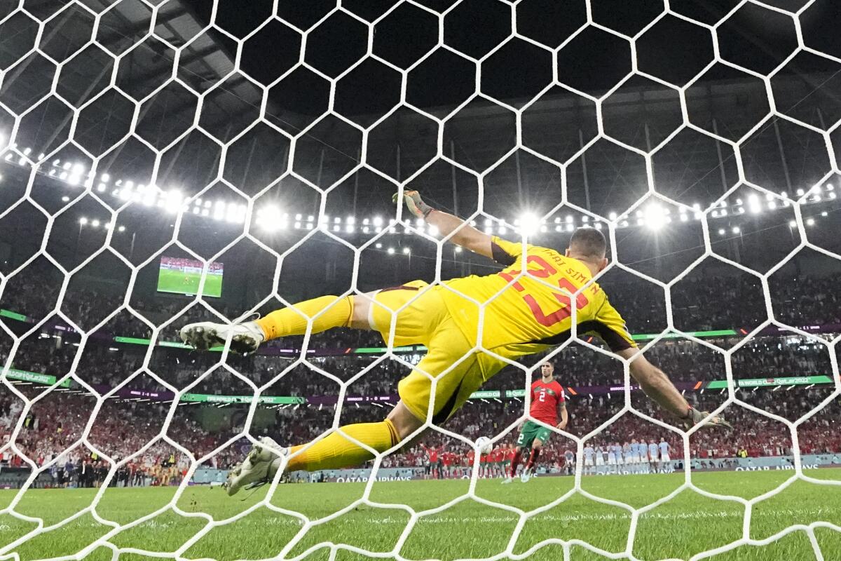 Morocco's Achraf Hakimi scores the decisive penalty during a shootout at the World Cup Round of 16.