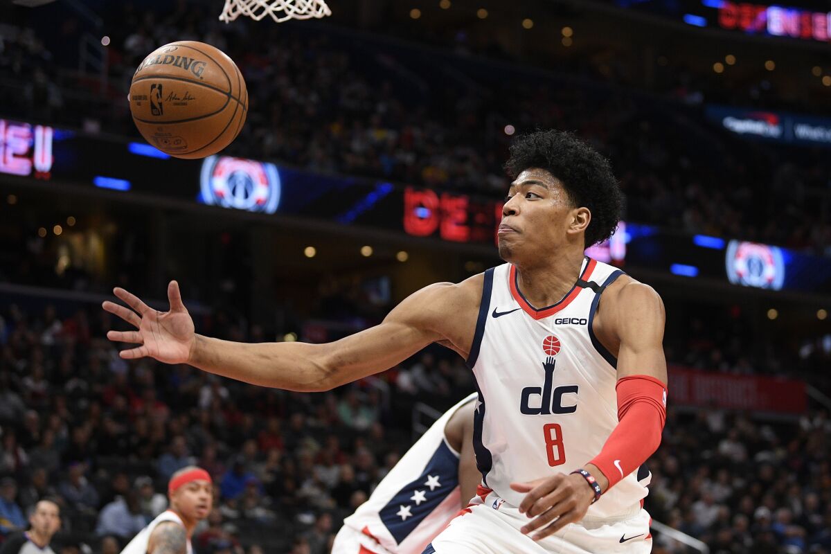 Washington Wizards forward Rui Hachimura (8), of Japan, goes for the ball during the first half of an NBA basketball game against the Golden State Warriors, Monday, Feb. 3, 2020, in Washington. (AP Photo/Nick Wass)