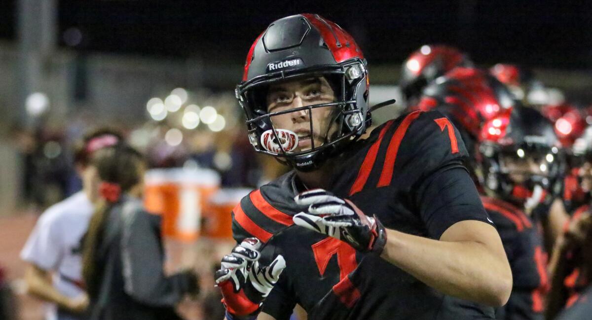 Murrieta Valley tight end Jack Yary warms up on the sideline.