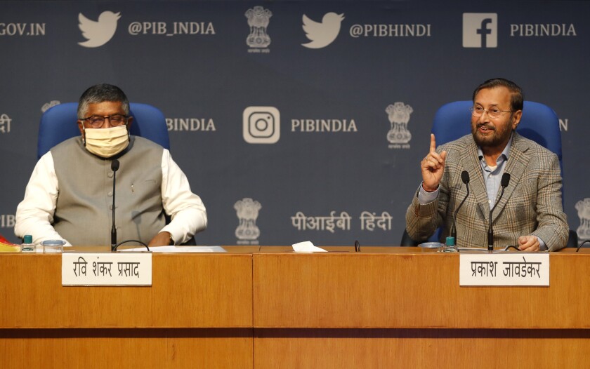 FILE - India's Information Technology Minister Ravi Shankar Prasad, left, and Information and Broadcasting Minister Prakash Javadekar address a press conference announcing new regulations for social media companies and digital streaming websites in New Delhi, India, Feb. 25, 2021. Twitter on Tuesday, July 5, 2022, challenged the Indian government in court over its recent orders to take down some content on the social media platform. The lawsuit is part of a growing confrontation between Twitter and New Delhi after the government passed the new set of sweeping regulations giving it more power to police online content. (AP Photo/Manish Swarup, File)