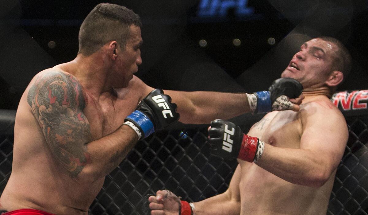 Fabricio Werdum, left, solidified his standing as one of MMA's all-time great heavyweights with a submission of Cain Velasquez on June 13, 2015.