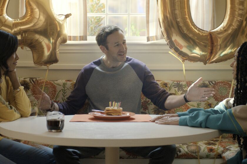 This image released by Apple TV+ shows Gabrielle Dennis, from left, Chris O’Dowd and Djouliet Amara in a scene from "The Big Door Prize." (Apple TV+ via AP)