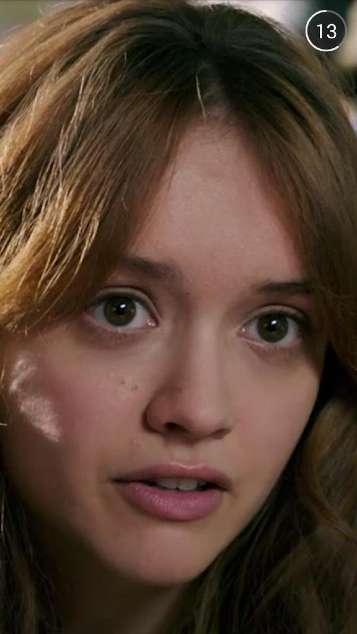Actress Olivia Cooke is seen a trailer for the movie "Ouija" that users on Snapchat had a chance to voluntarily watch last weekend.