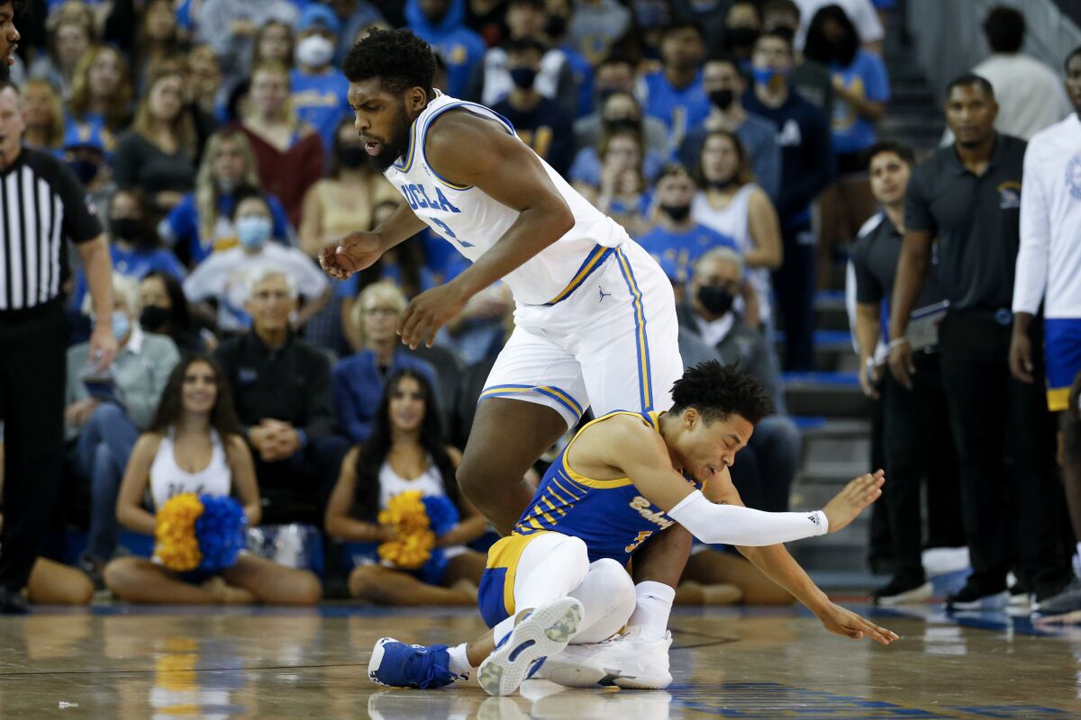 UCLA forward Cody Riley collides with Cal State Bakersfield guard Grehlon Easter.