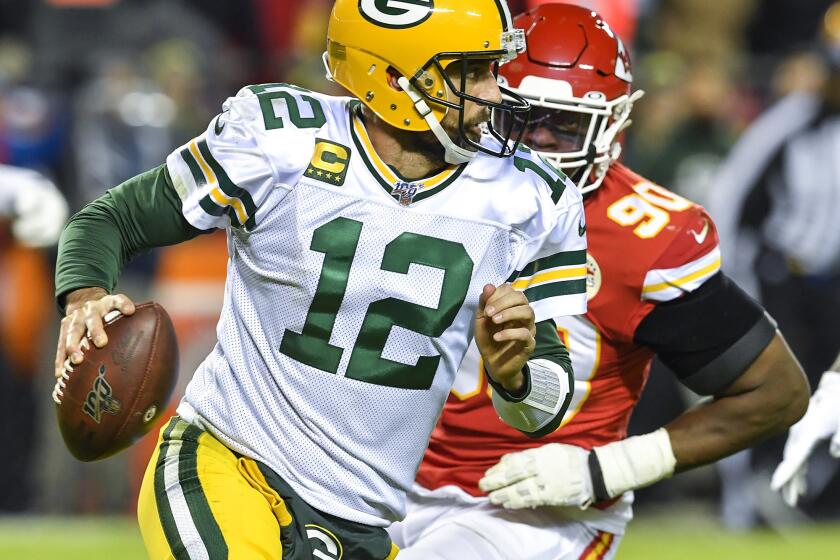 Green Bay Packers quarterback Aaron Rodgers (12) is chased out of the pocket in the second quarter by Kansas City Chiefs defensive end Emmanuel Ogbah at Arrowhead Stadium in Kansas City, Mo., on Sunday, Oct. 27, 2019. (Rich Sugg/Kansas City Star/TNS) ** OUTS - ELSENT, FPG, TCN - OUTS **