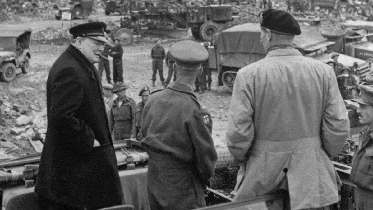 Does Trump belong in this picture? British Prime Minister Winston Churchill, left, overlooks a Normandy battlefield after D-day, 1944, with British commander Sir Miles Dempsey, center, and Field Marshal Bernard Montgomery.
