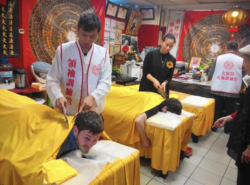 A knife massage clinic in downtown Taipei, Taiwan. Getting tenderized for 10 minutes costs about $7.