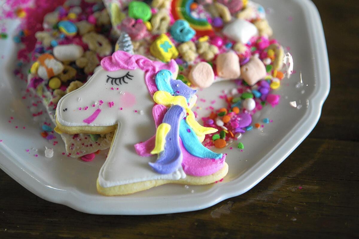 A unicorn cookie and unicorn bark at Creme and Sugar.