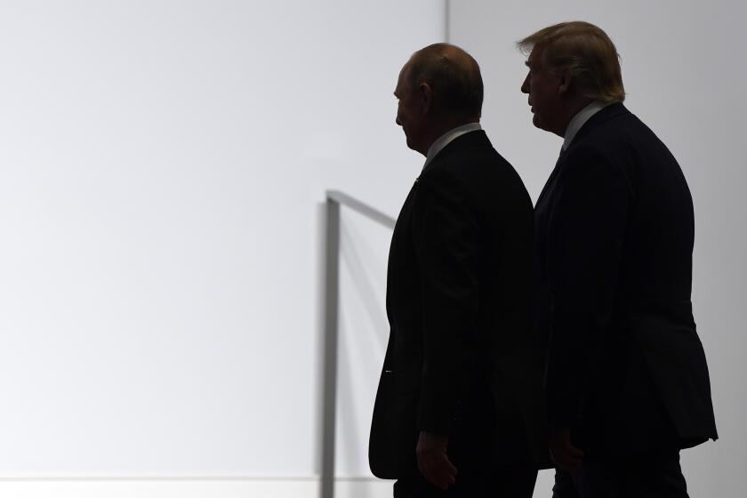 FILE - In this June 28, 2019, file photo, President Donald Trump and Russian President Vladimir Putin walk to participate in a group photo at the G20 summit in Osaka, Japan. An odd new front in the U.S.-Russian rivalry has emerged as a Russian military cargo plane bearing a load of urgently needed medical supplies landed in New York’s JFK airport. (AP Photo/Susan Walsh, File)