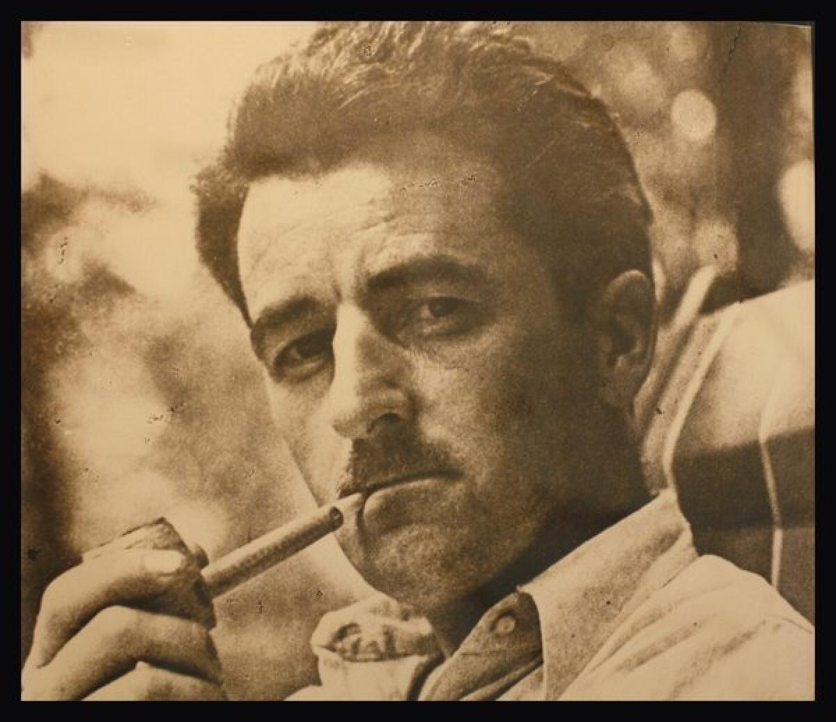 A photograph of William Faulkner on display at Rowan Oak, his home in Oxford, Miss.