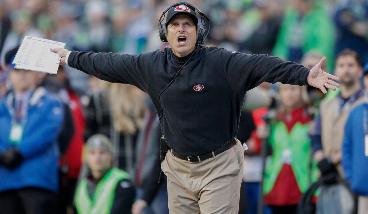 San Francisco Coach Jim Harbaugh reacts to a call during the 49ers' loss to the Seattle Seahawks, 17-7, on Sunday.