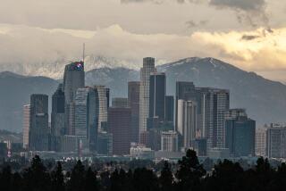 LOS ANGELES, CA - JANUARY 30: Downtown Los Angeles skyline with snow capped mountains in background on Monday, Jan. 30, 2023 in Los Angeles, CA. (Jason Armond / Los Angeles Times)