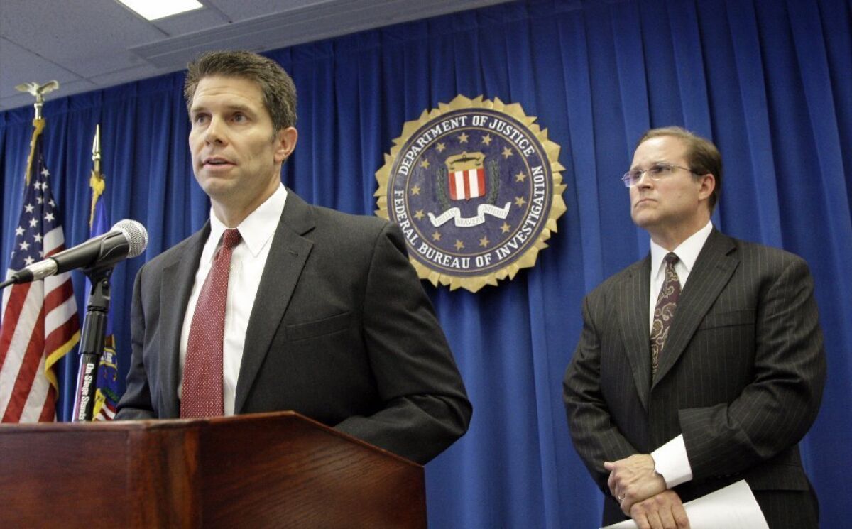 Bill Lewis, assistant agent in charge of the FBI's Los Angeles field office, right, and David Bowdich, special agent in charge of the FBI's L.A. area counterterrorism unit, discuss the arrests last month of four men suspected of promoting terrorist activities east of Los Angeles.