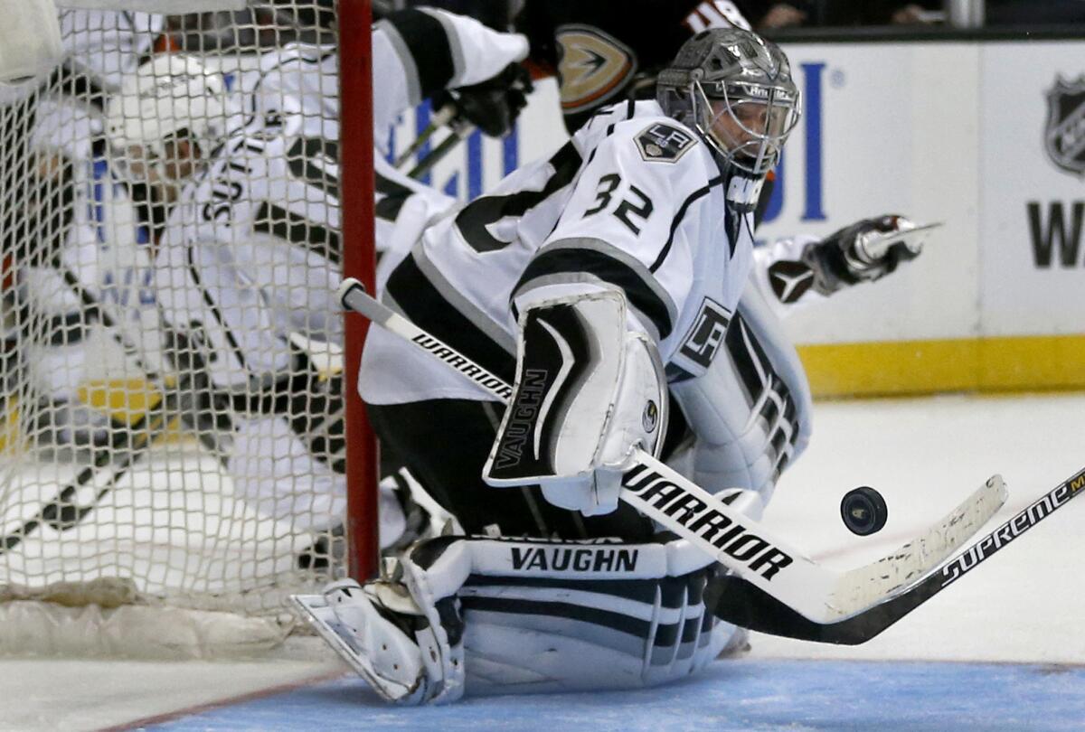Kings goaltender Jonathan Quick, making a save in a preseason game on Oct. 2, hasn't played since he was injured in the season opener.