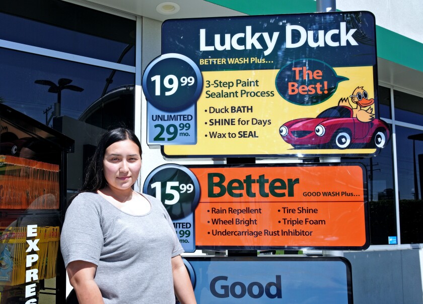 Priscilla Perez, 22 of Anaheim at her place of employment, Quick Quack Car Wash in Anaheim.